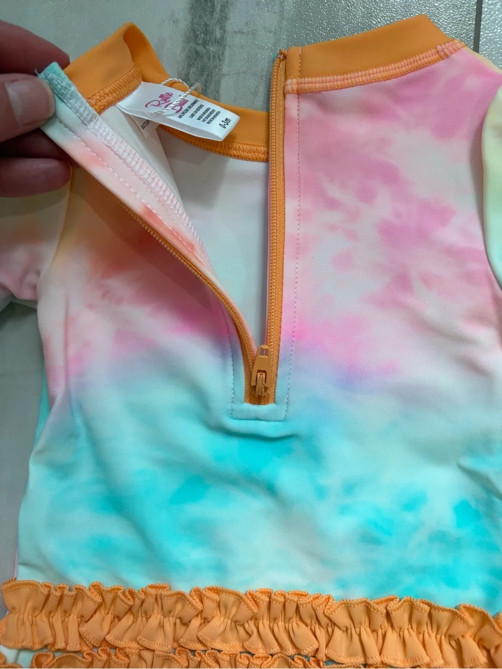 NWT RuffleButts Rainbow Tie Dye Long Sleeve Rash Guard One Piece Swimsuit, 0-3M